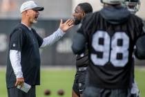 Raiders New Defensive Coordinator Gus Bradley speaks with Raiders defensive end Yannick Ngakoue ...