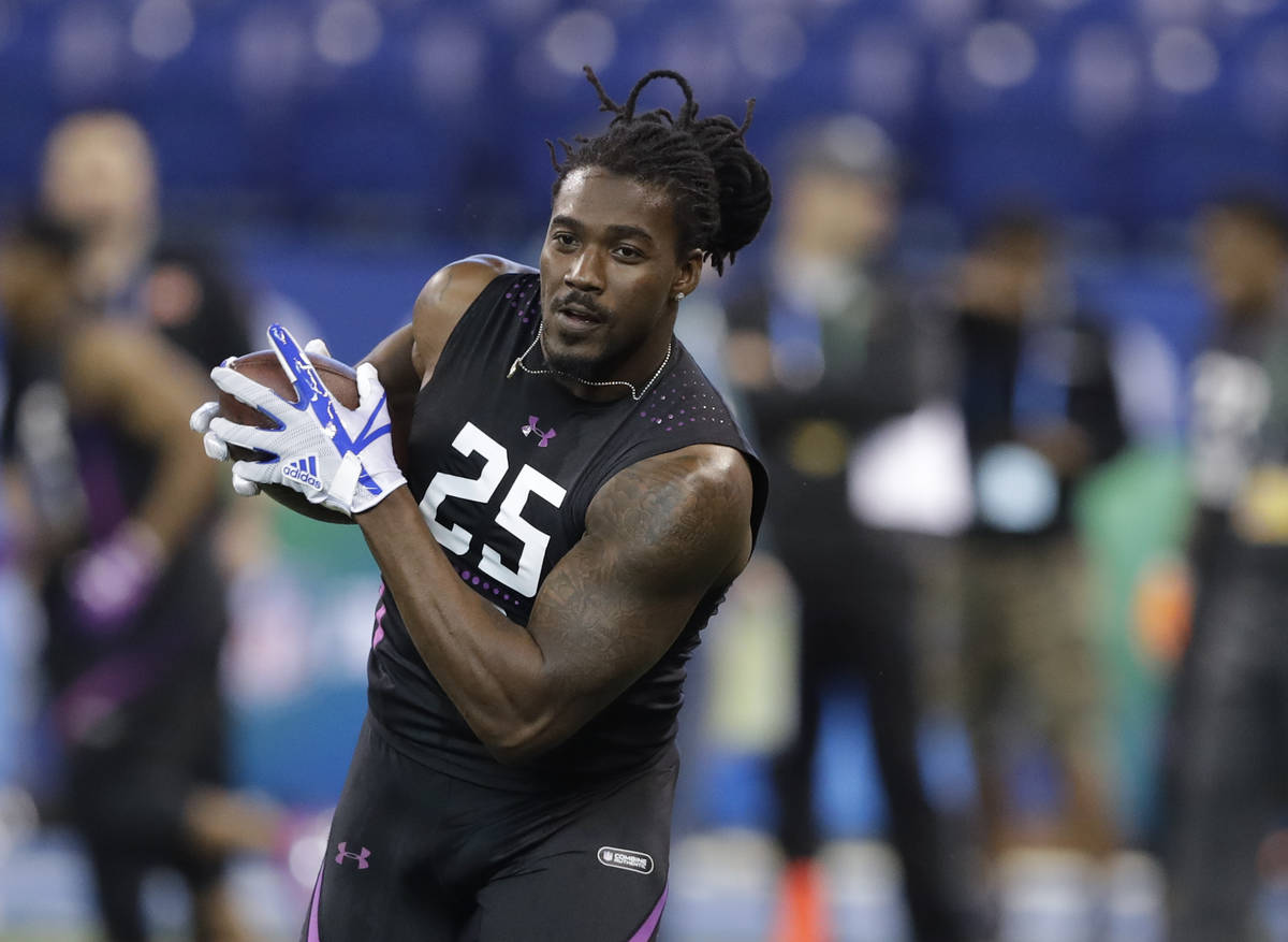 Alabama running back Bo Scarbrough runs a drill during the NFL football scouting combine, Frida ...