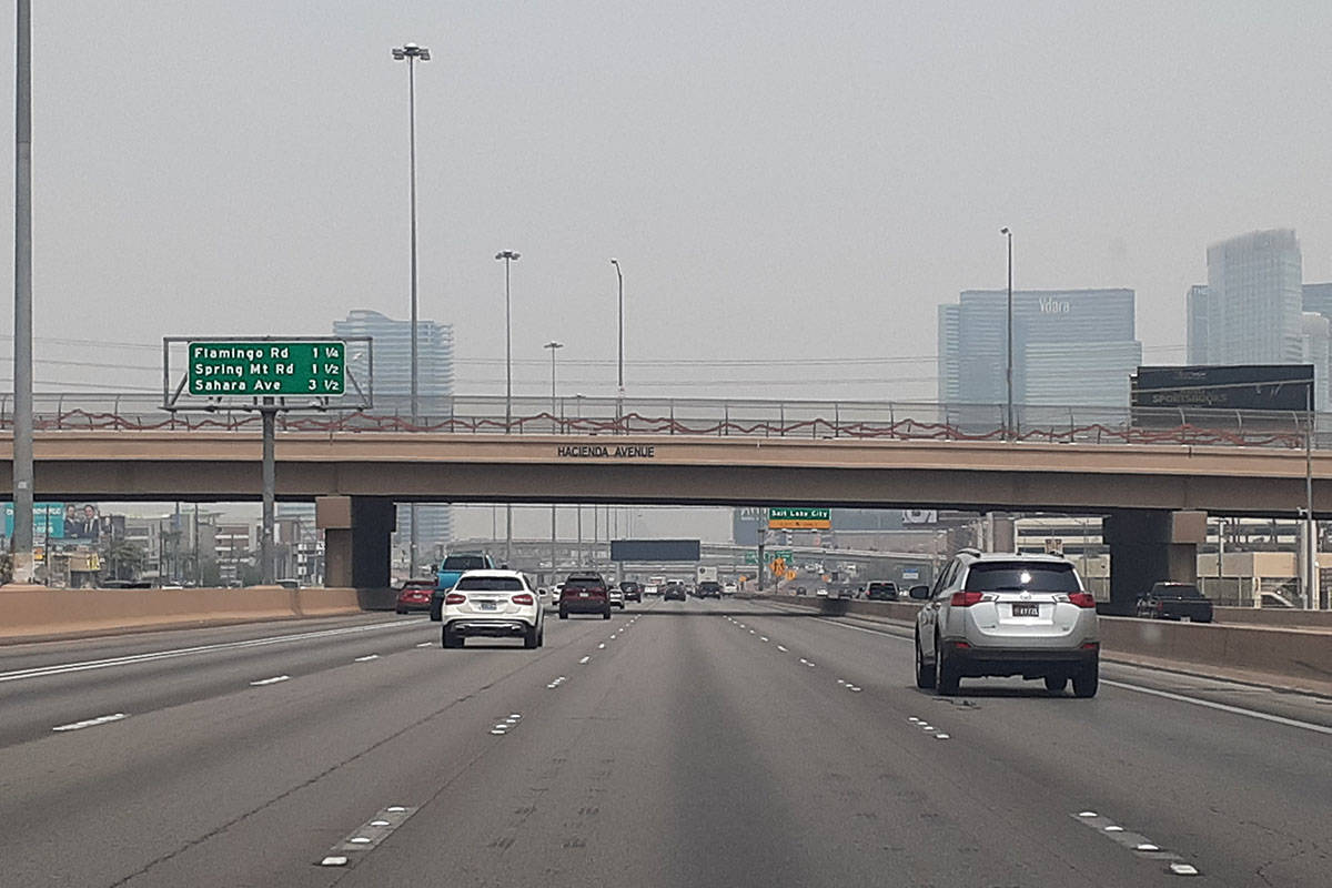 A haze domitates the Las Vegas sky Saturday, Aug. 7, 2021, on Interstate 15 in Las Vegas. (Marv ...