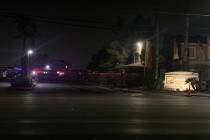 Las Vegas police at the scene of a homicide in the 3600 block of East Owens Avenue near Pecos R ...