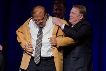 Tom Flores, a member of the Pro Football Hall of Fame Centennial Class, receives his gold jacke ...