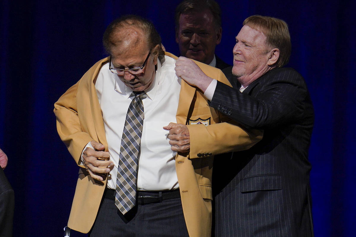 Tom Flores, a member of the Pro Football Hall of Fame Centennial Class, receives his gold jacke ...