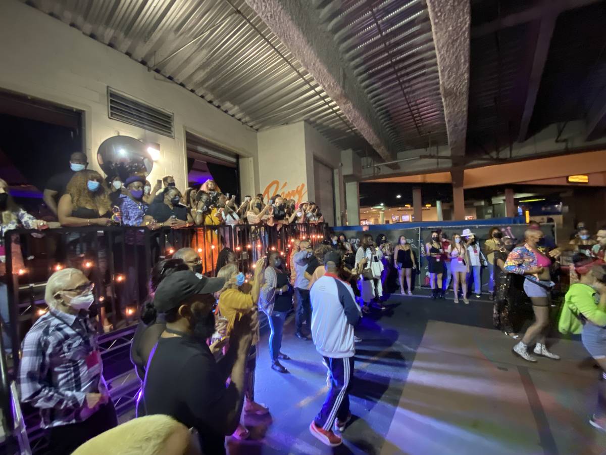 The Block Party scene at "Backstory Experience," Usher's pre-show immersive production, is show ...