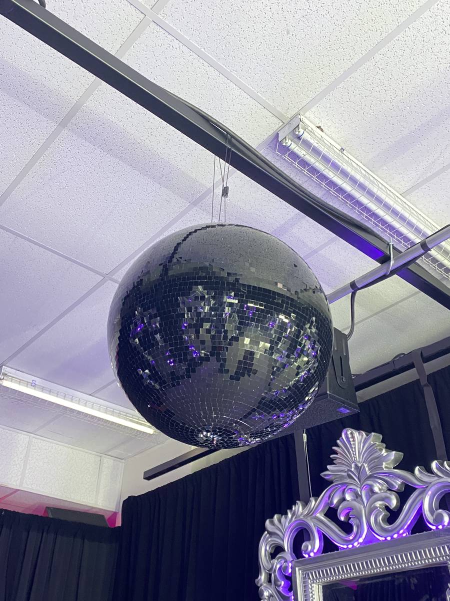 A mirrored ball is shown in The Future Room at "Backstory Pass," Usher's pre-show immersive pro ...