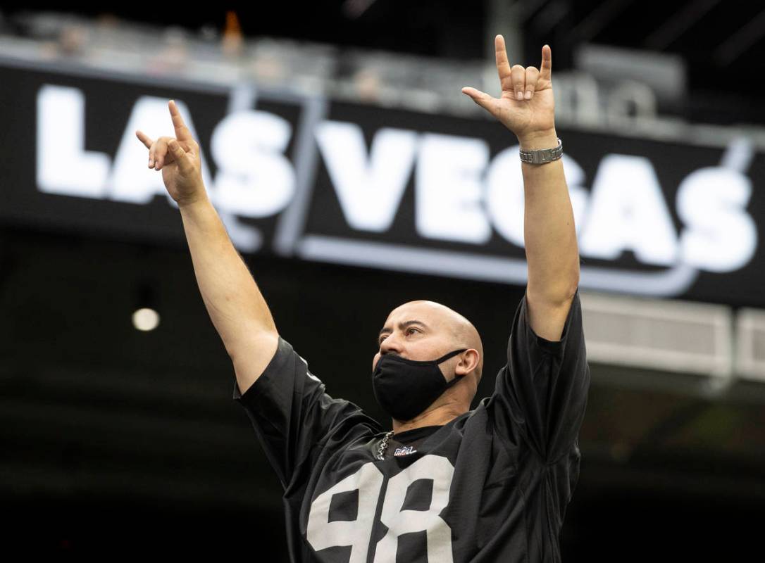 Raider fans take in the action during a special training camp practice for season ticket holder ...
