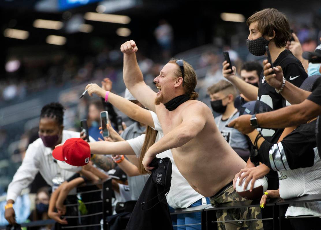 Raider fans take in the action during a special training camp practice for season ticket holder ...