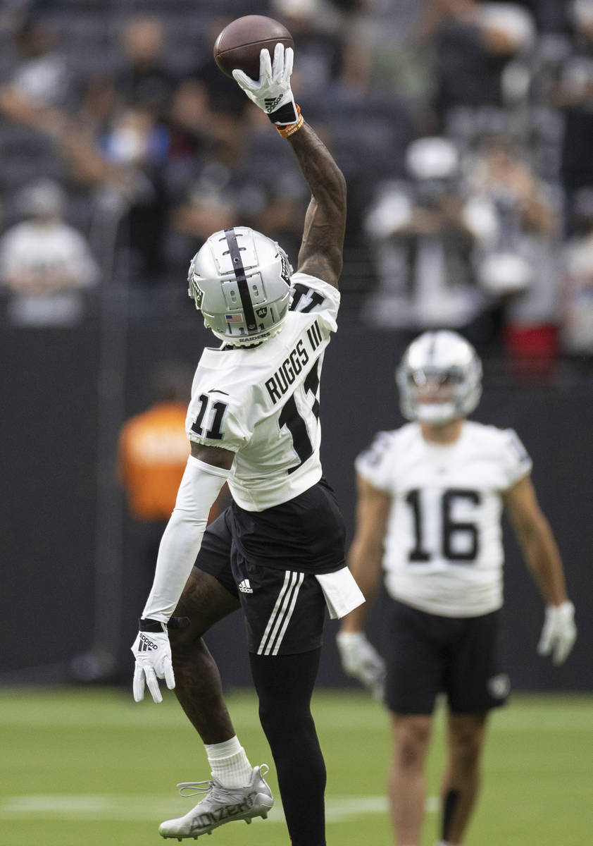 Raiders wide receiver Henry Ruggs III (11) makes a catch during a special training camp practic ...