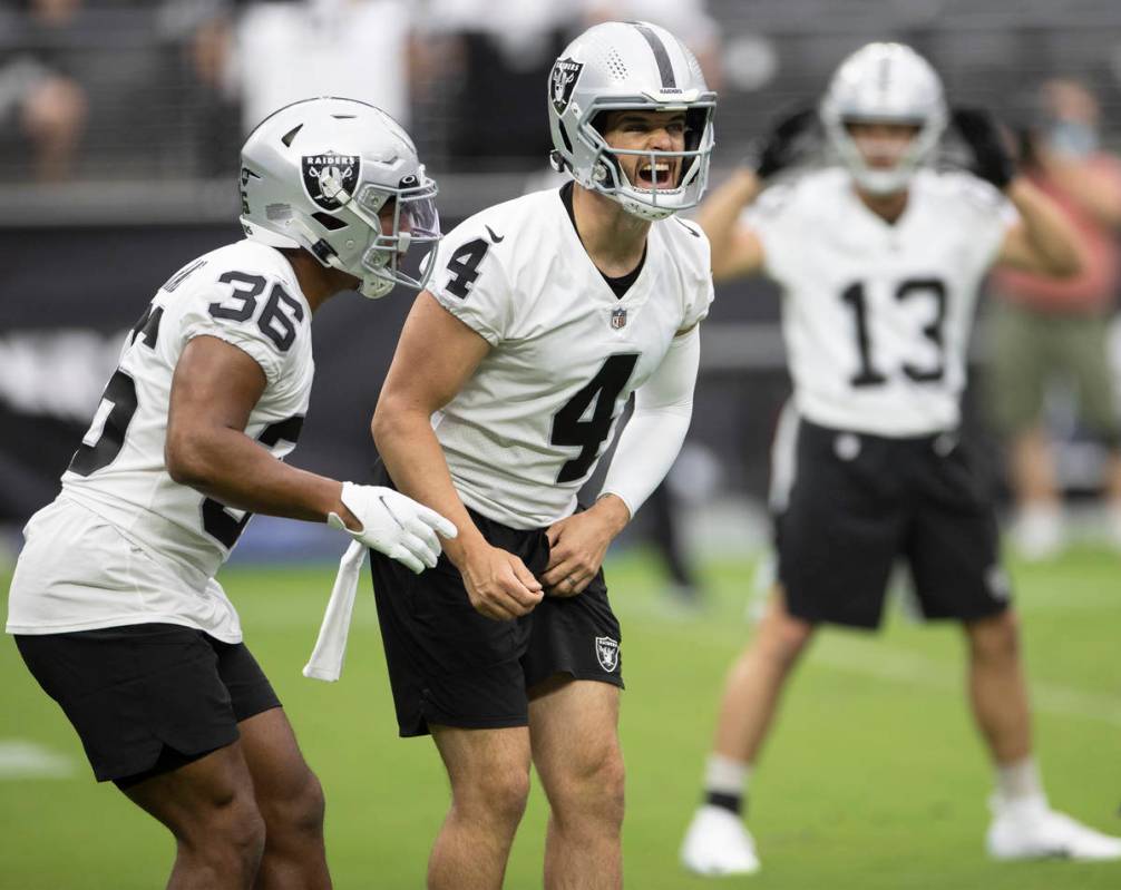 Raiders quarterback Derek Carr (4) audibles to his receivers during a special training camp pra ...