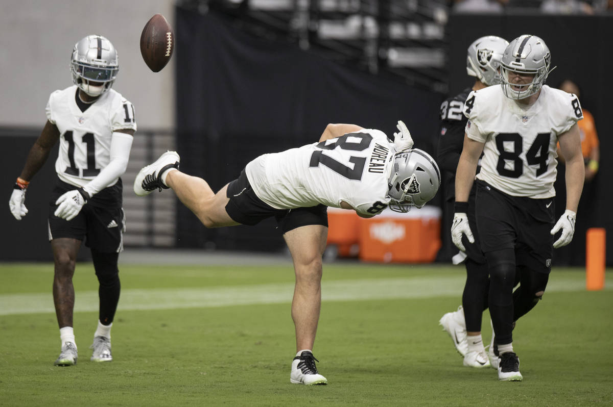 Raiders tight end Foster Moreau (87) celebrates in the end zone after scoring a touchdown durin ...