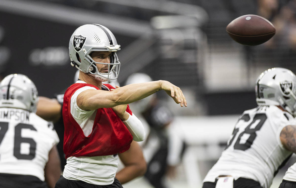 Raiders quarterback Derek Carr (4) passes the ball during a special training camp practice for ...