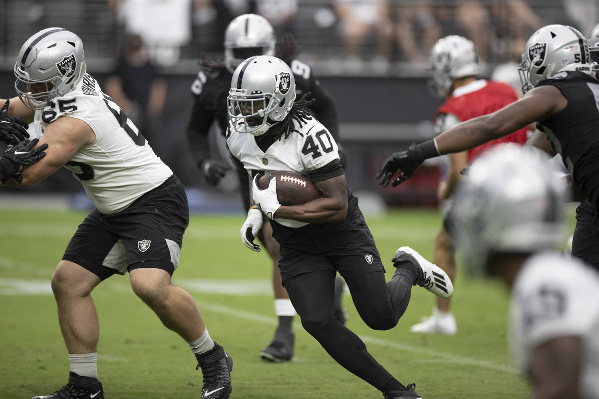 Raiders running back Bo Scarbrough (40) breaks a big run up the middle during a special trainin ...