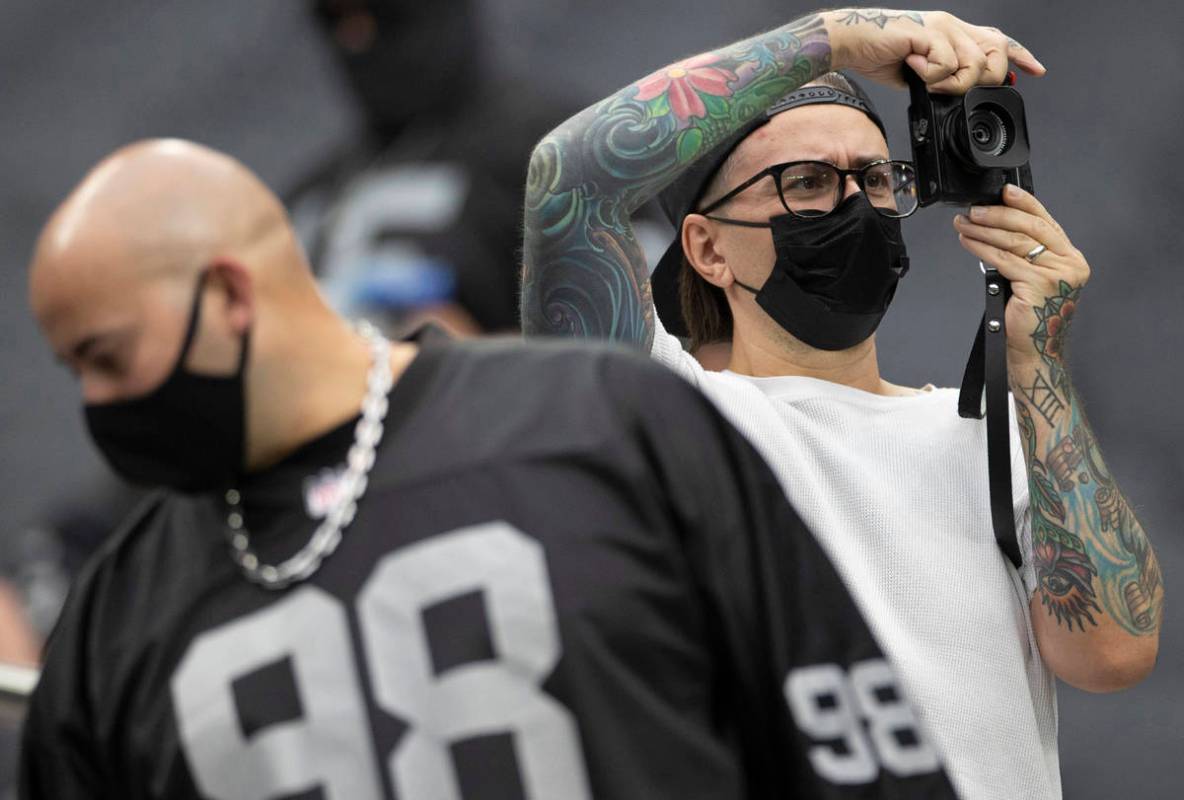 Raider fans take in the action during a special training camp practice for season ticket holder ...