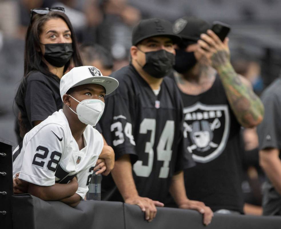Raider fans take in the action during a special training camp practice for season ticket holder ...