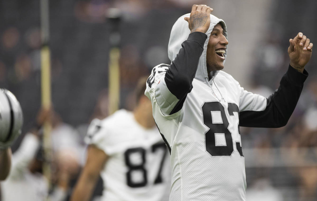 Raiders tight end Darren Waller (83) shares a laugh with teammates during a special training ca ...