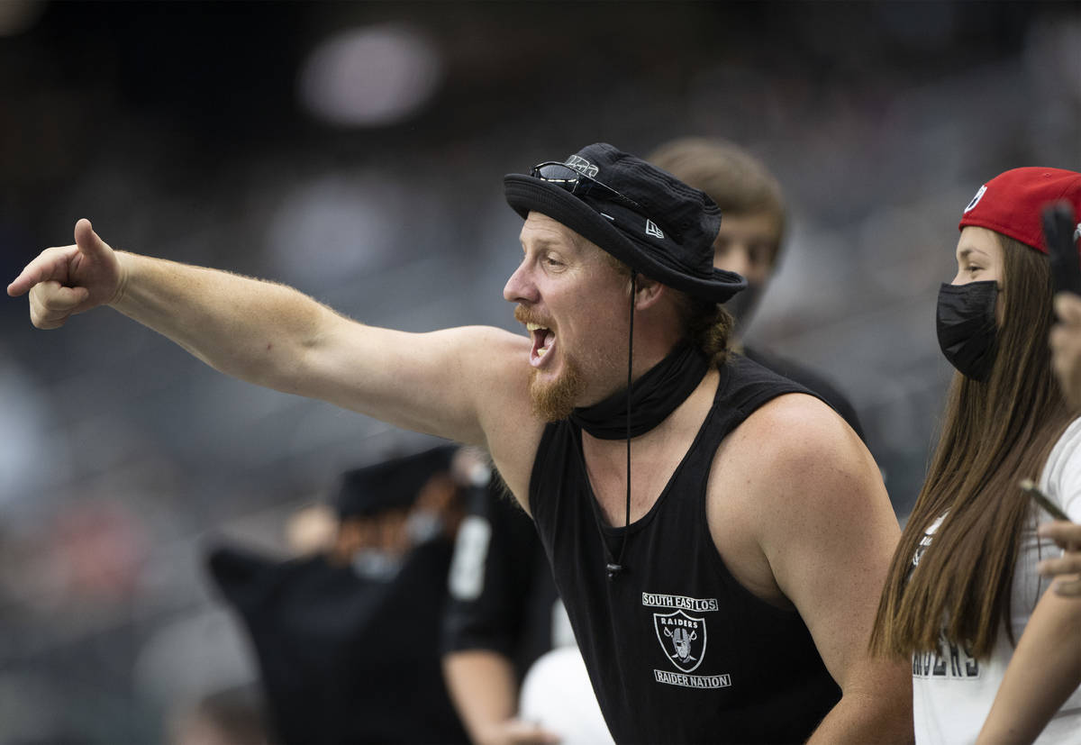 Raider fans take in the action during a special training camp practice for season ticket holder ...