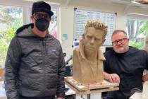 Zak Bagans, left, and artist Steven Whyte are shown with Whyte's James Dean sculpture. When fi ...