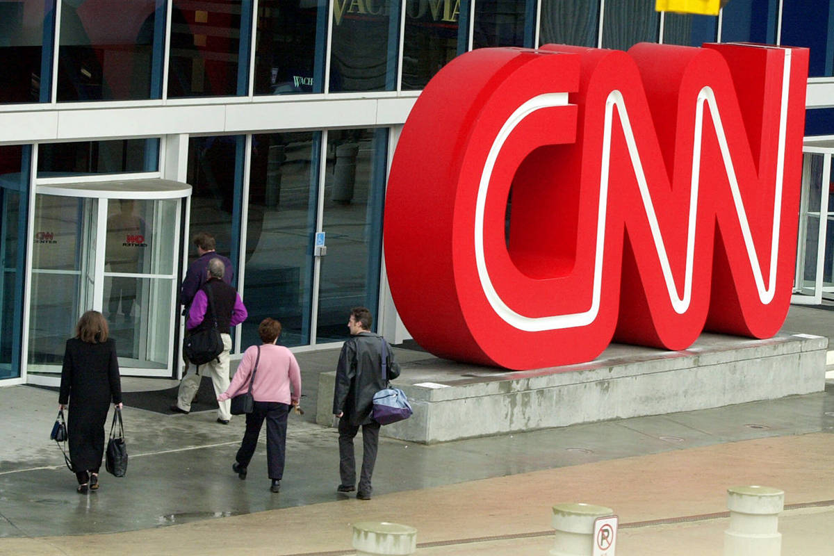 This Jan. 17, 2001 file photo shows pedestrians entering CNN Center, the headquarters for CNN, ...
