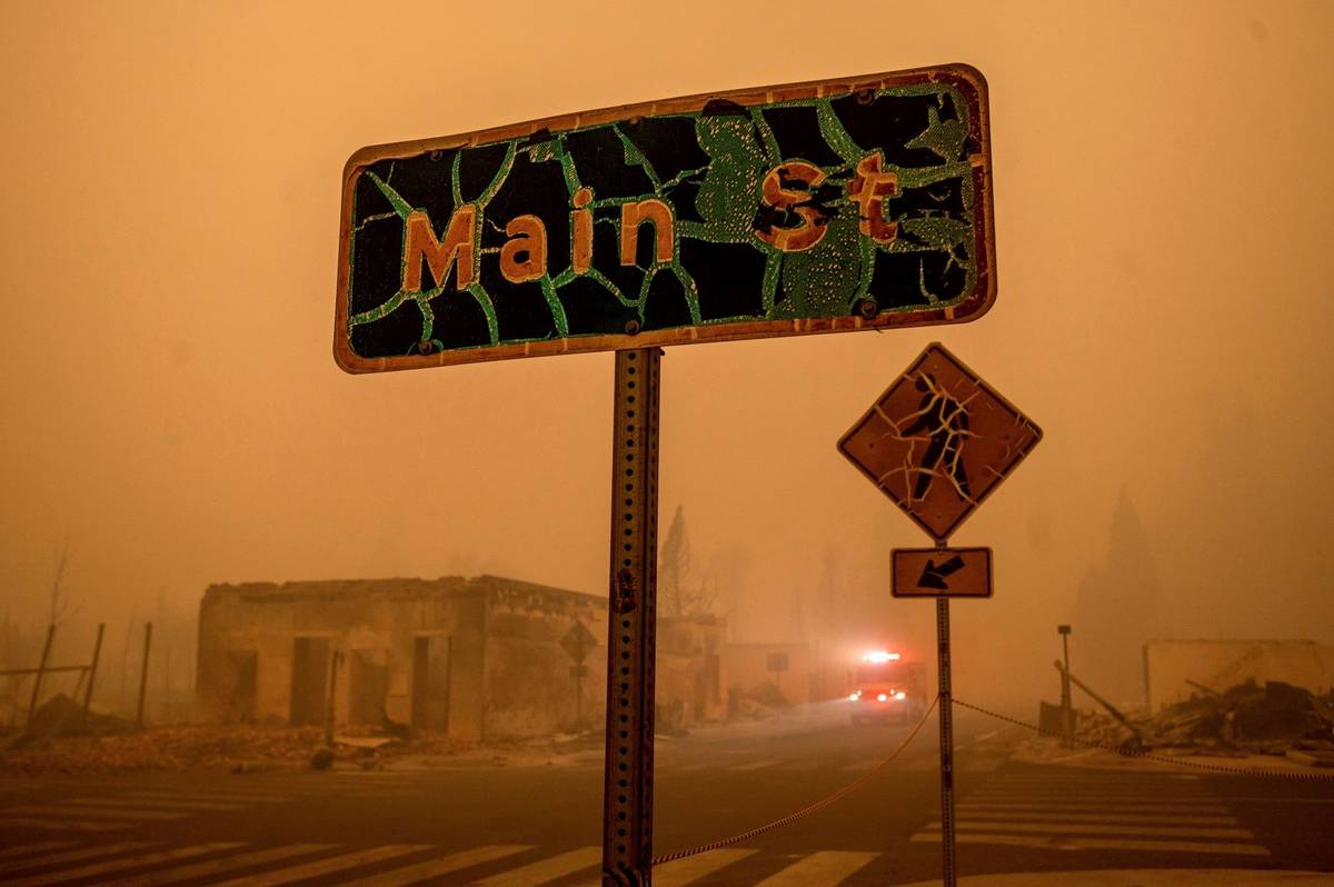 A fire truck drives through central Greenville, which was largely leveled by the Dixie Fire, Fr ...