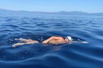 James Savage, 14, of Los Banos, Calif., swims in Lake Tahoe on Aug. 1, 2021. (AP Photo/By Jilli ...