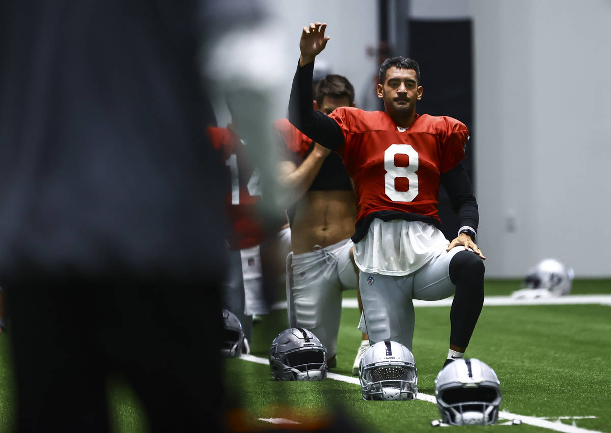 Raiders quarterback Marcus Mariota stretches during training camp at Raiders Headquarters/Inter ...