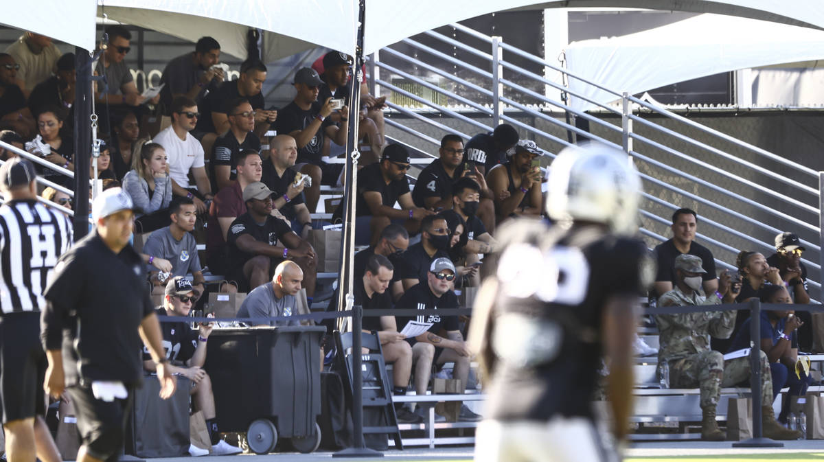 People, including active-duty military, watch training camp at Raiders Headquarters/Intermounta ...