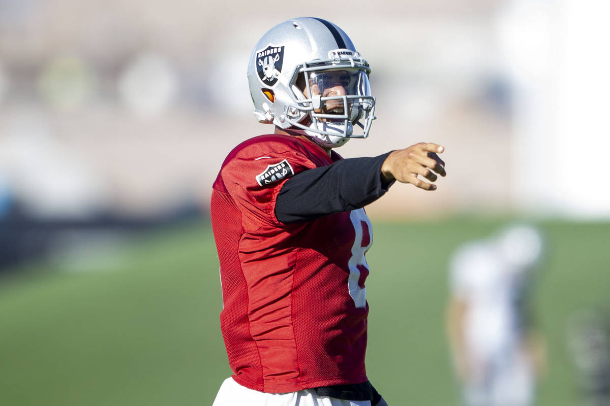 Raiders quarterback Marcus Mariota (8) reacts after throwing a pass during their NFL training c ...