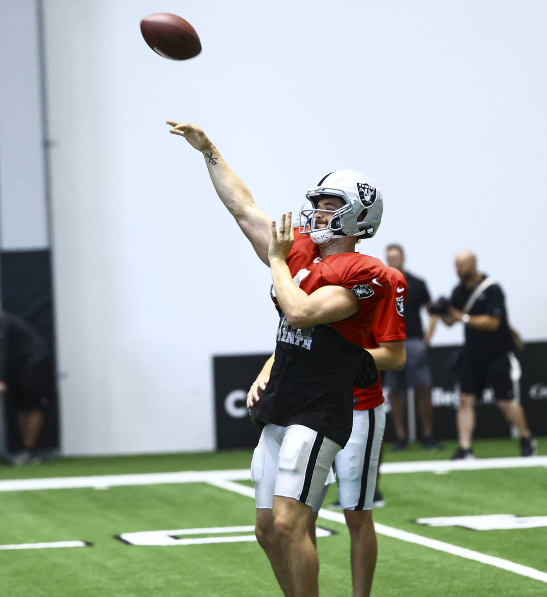 Raiders quarterback Derek Carr throws a pass during training camp at Raiders Headquarters/Inter ...