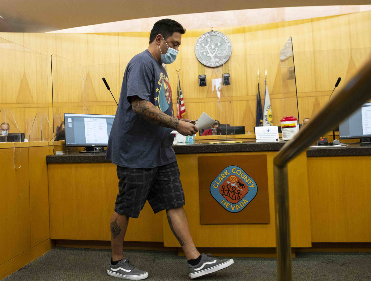 Tom Stidham, protesting against a COVID-19 mandate, returned to his seat after addressing the b ...