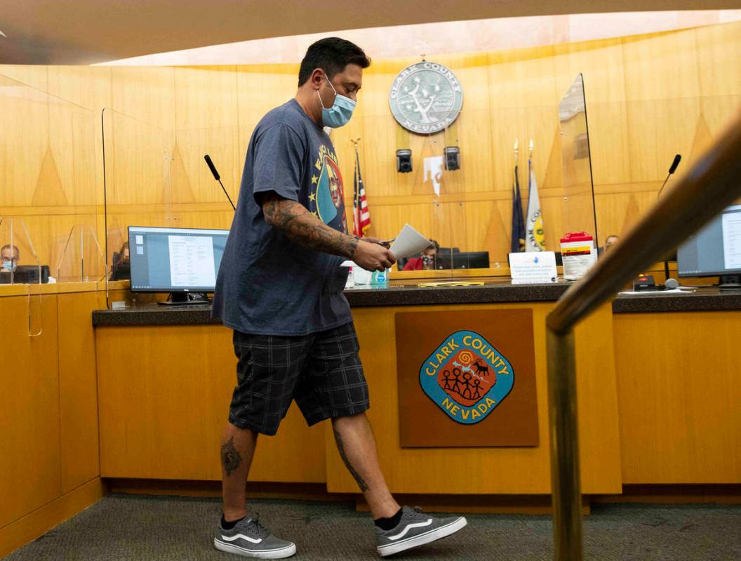 Tom Stidham, protesting against a COVID-19 mandate, returned to his seat after addressing the b ...
