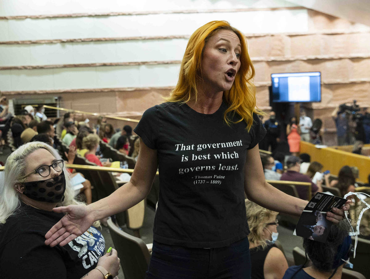Stephanie Kinsley, protesting against a COVID-19 mandate, reacts during the Clark County School ...