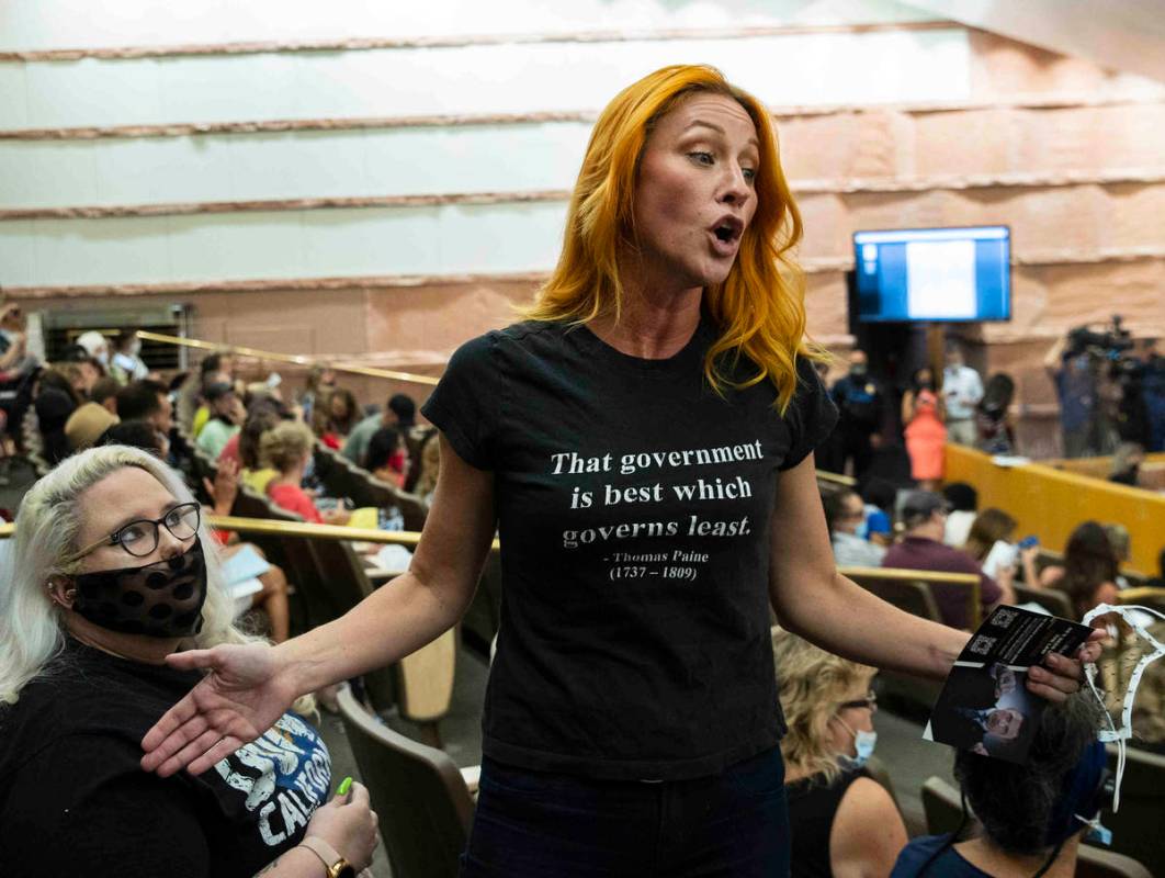 Stephanie Kinsley, protesting against a COVID-19 mandate, reacts during the Clark County School ...