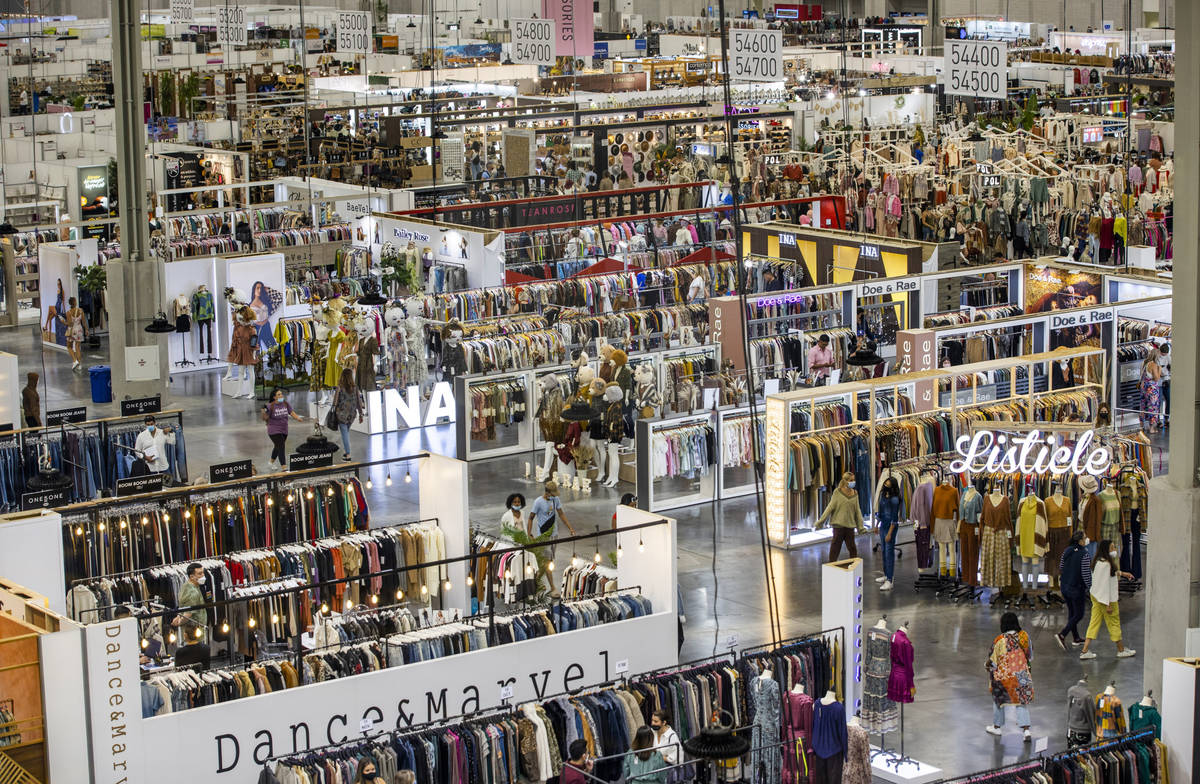 Attendees comb through new items within numerous displays in the west hall during the MAGIC app ...