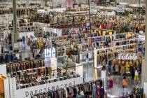 Attendees comb through new items within numerous displays in the west hall during the MAGIC app ...