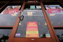 A Now Hiring sign at a business in Richmond, Va., Wednesday, June 2, 2021. U.S. employers poste ...