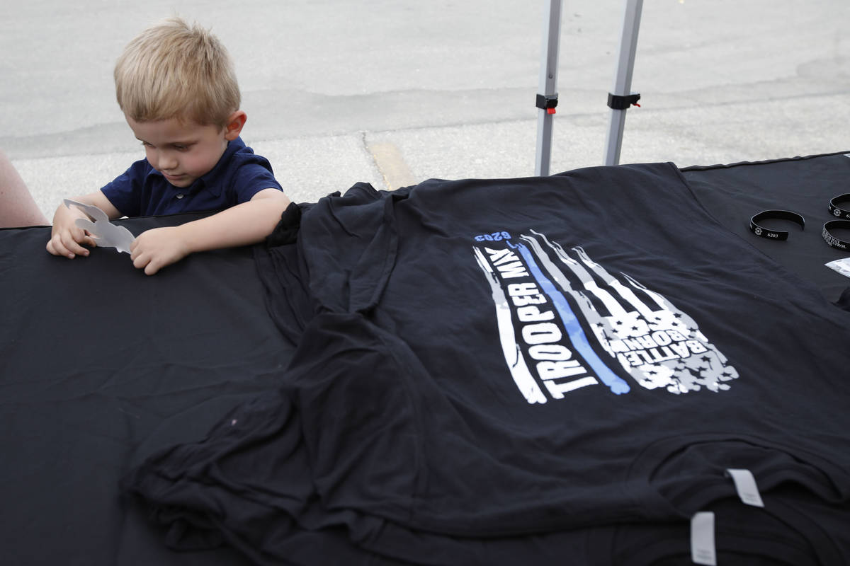 Slain Nevada Highway Patrol trooper Micah May's son Raylan, 3, attends a fundraiser for his fa ...