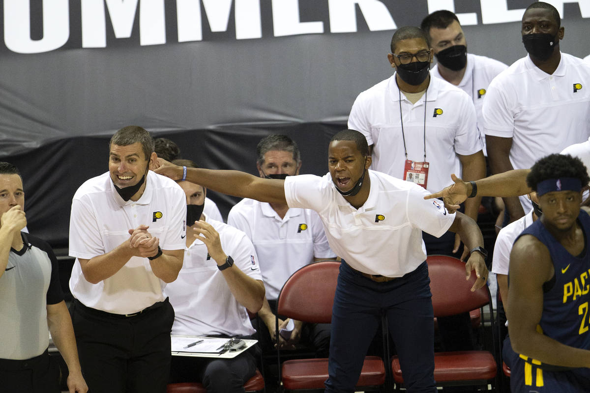 Members of the Indiana Pacers coaching staff, including head coach Mike Weinar, left, express a ...