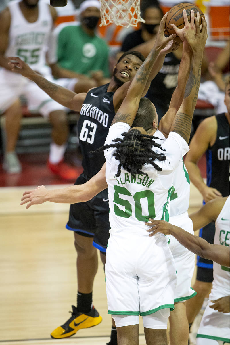 Orlando Magic forward Shakur Juiston (62) knocks down a shot by Boston Celtics guard Payton Pri ...