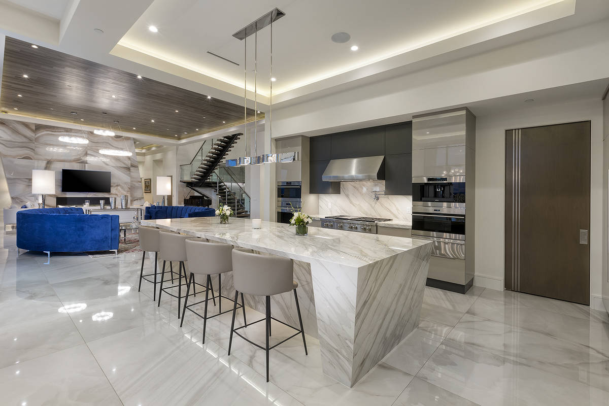 The kitchen is off the living room. (Kristen Routh-Silberman)