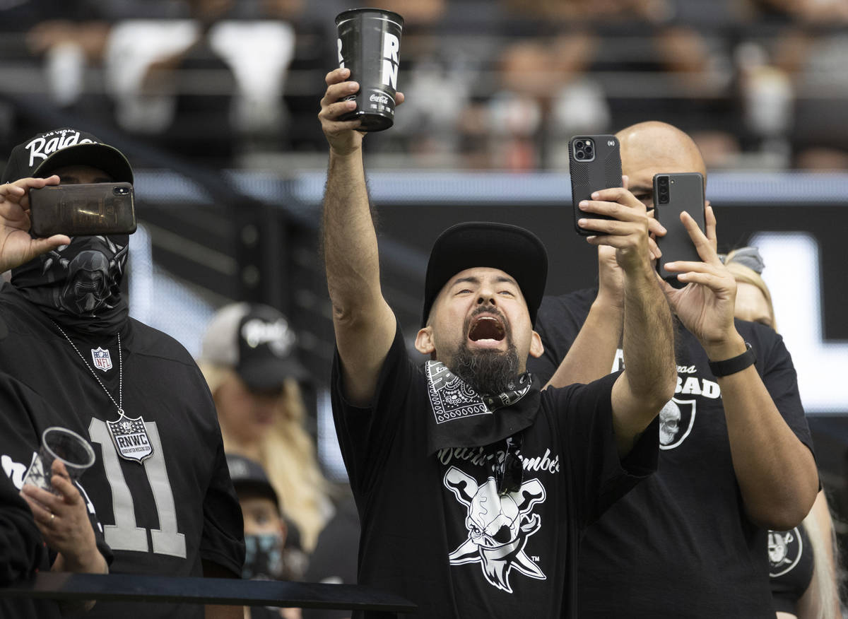Raider fans take in the action during a special training camp practice for season ticket holder ...