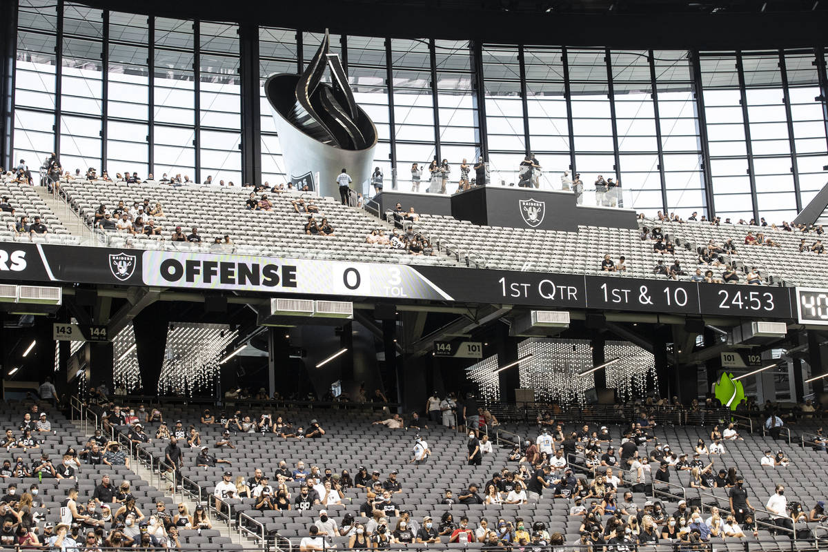 Raider fans take in the action during a special training camp practice for season ticket holder ...