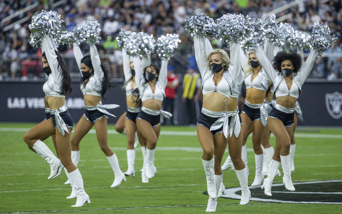 The Raiderettes perform for the fans before the Raiders home opening pre-season NFL football ga ...