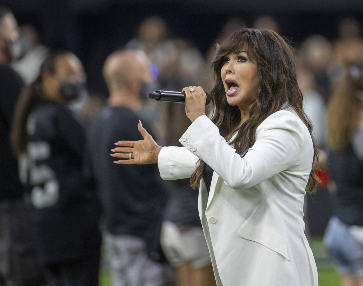 Marie Osmond sings the National anthem before the Raiders home opening pre-season NFL football ...
