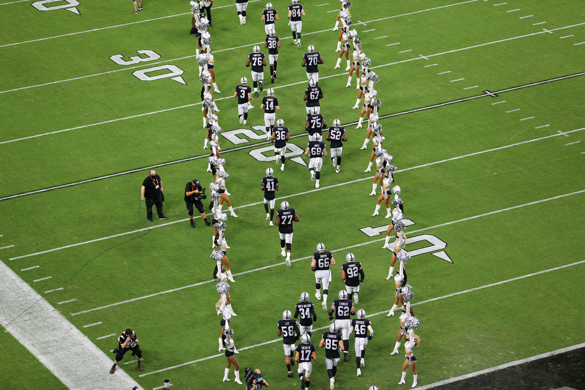 Las Vegas Raiders take the field for a NFL preseason game against the Seattle Seahawks at Alleg ...