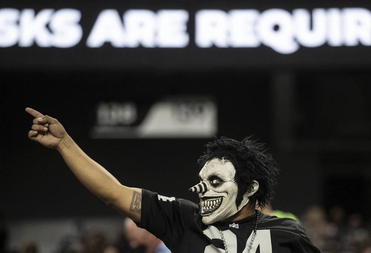 Raiders fans watch the action during an NFL preseason football game against the Seattle Seahawk ...