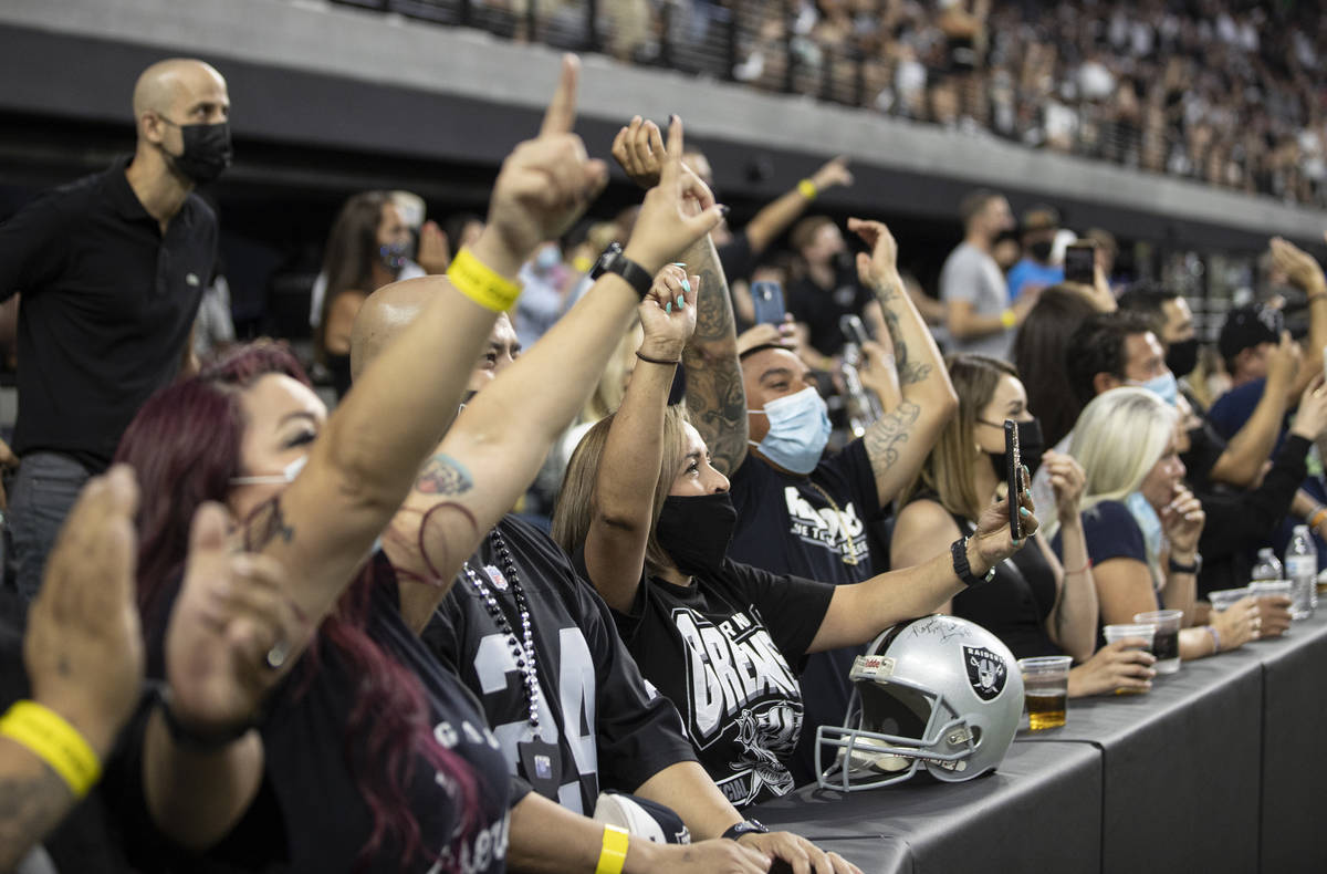 Raiders fans watch the action during an NFL preseason football game against the Seattle Seahawk ...