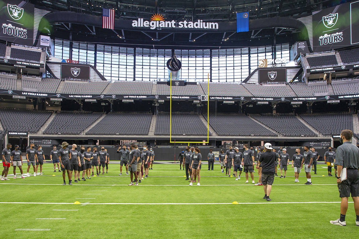 Airmen from Nellis and Creech Air Force Bases gather on the field during a Salute to Service Bo ...