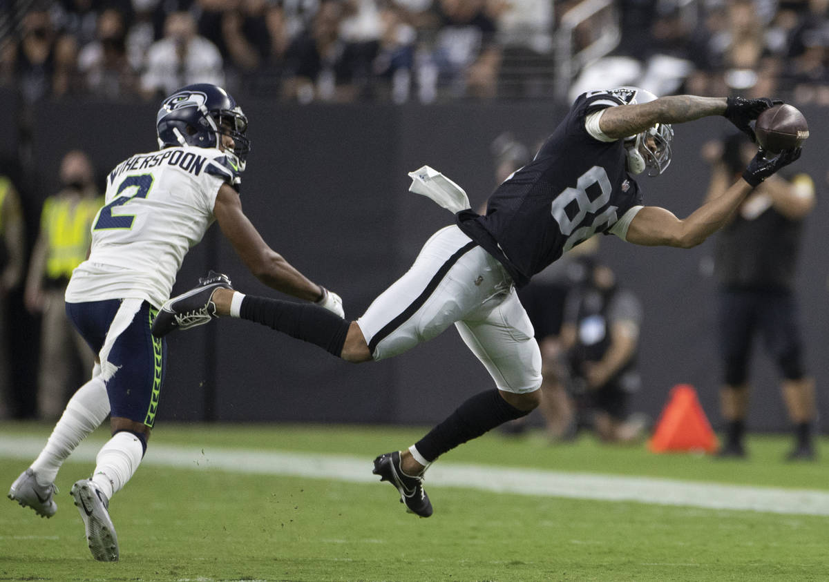 Raiders wide receiver Marcell Ateman (88) makes a diving catch past Seattle Seahawks cornerback ...