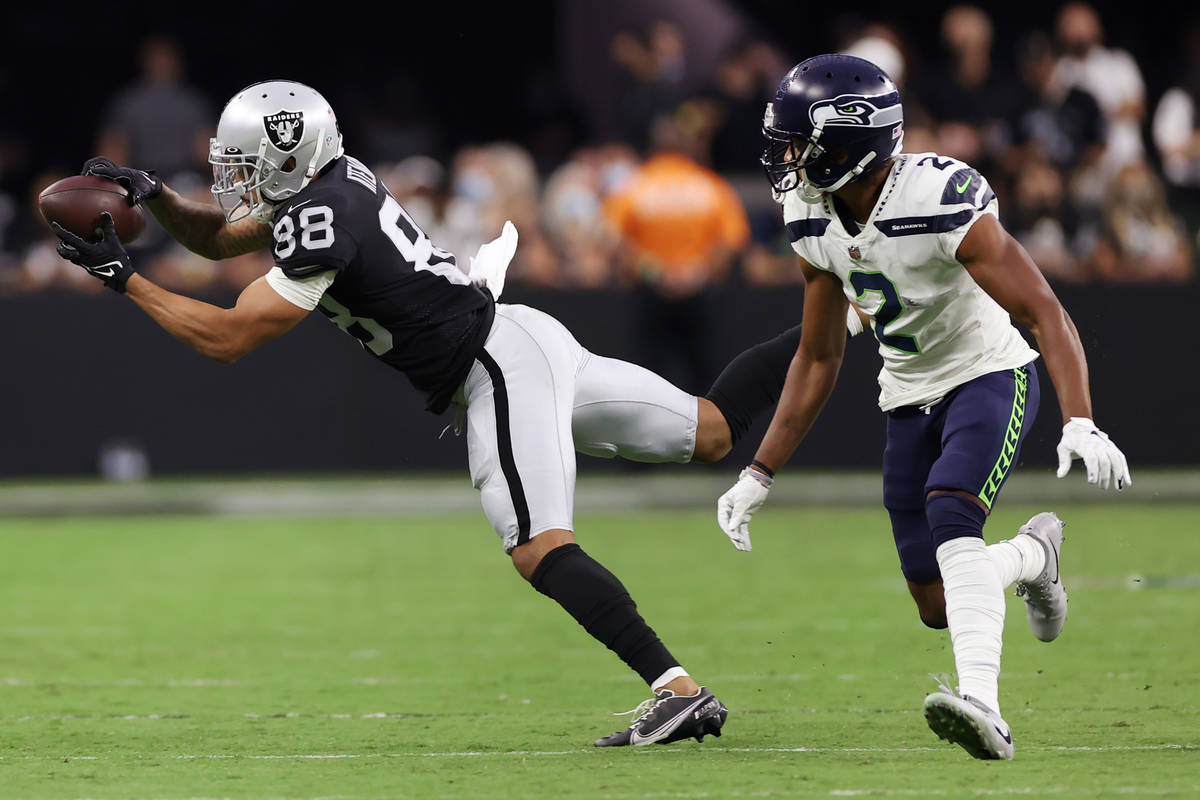 Las Vegas Raiders wide receiver Marcell Ateman (88) goes for the ball before dropping it under ...