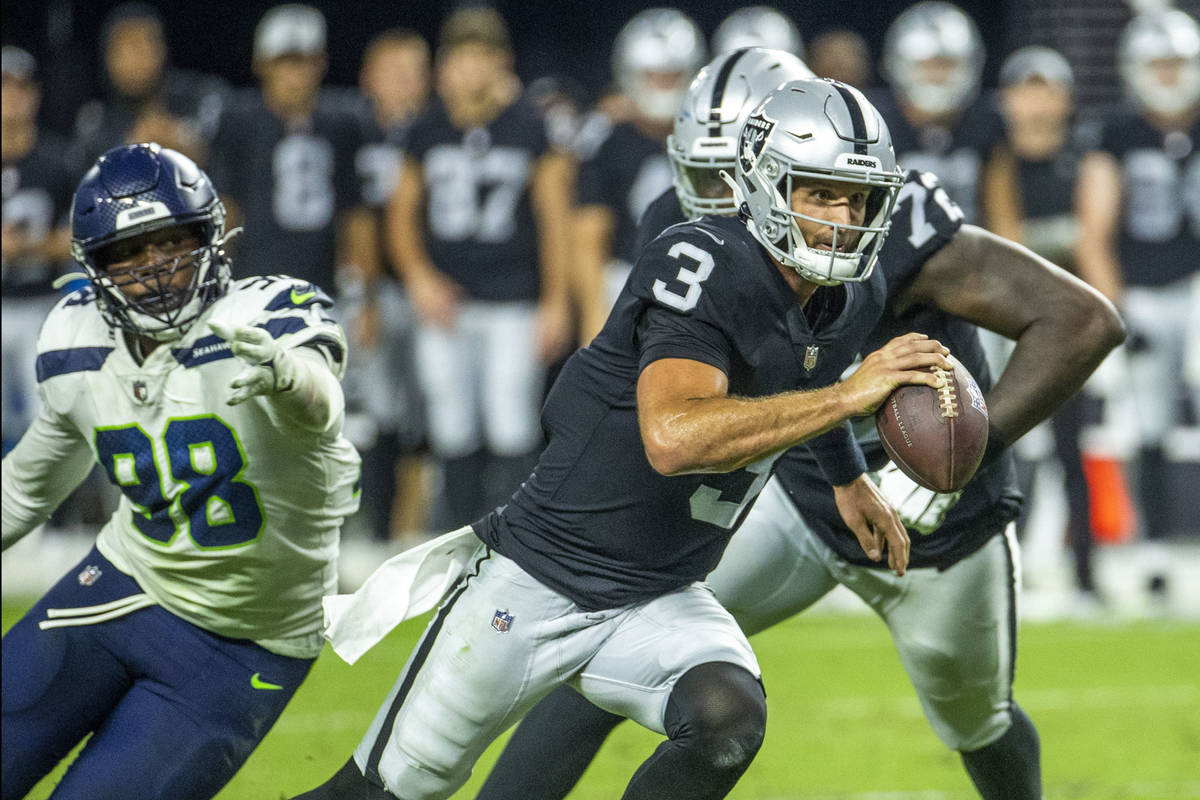 Raiders quarterback Nathan Peterman (3) breaks free for a run near the end zone past Seattle Se ...