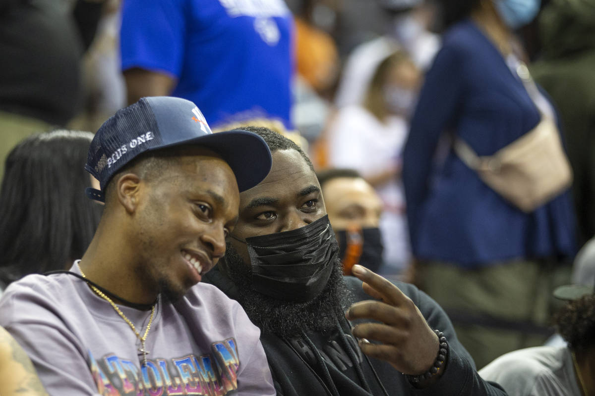 Agent and former UNLV basketball player Jordan Cornish, right, watches a NBA Summer League game ...